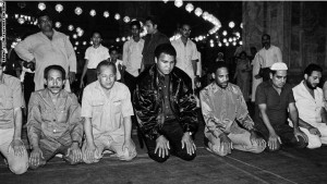 Former heavyweight world boxing champion Muhammad Ali (C) prays on October 05, 1986 at the Mosque of Muhammad Ali Pasha or Alabaster Mosque in Cairo, Egypt.        (Photo credit should read MIKE NELSON/AFP/Getty Images)